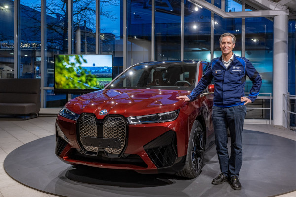 Christoph Schröder, Head of BMW Group Plant Dingolfing, showing the BMW iX