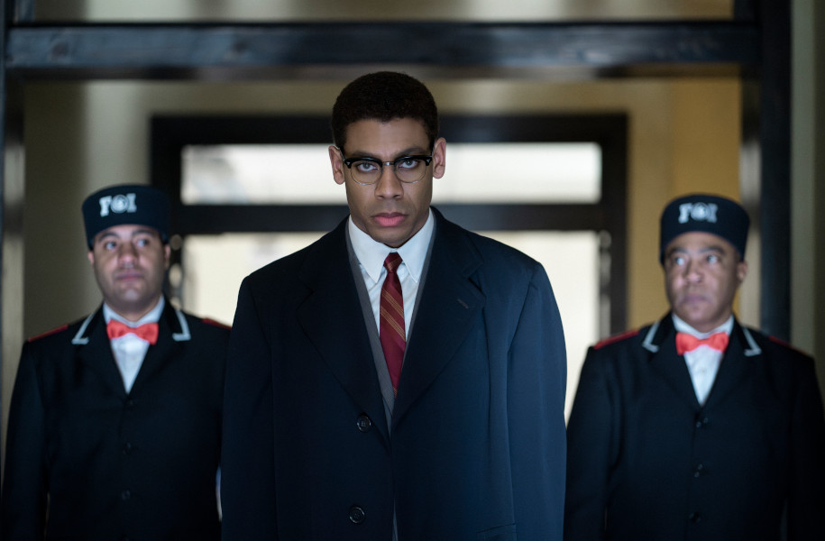 Malcolm X, played by Aaron Pierre, is escorted from Temple in GENIUS: MLK/X. (National Geographic/Richard DuCree)